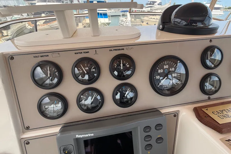 Slide: The Image of Instrument panel of a 1999 Carver 380 Santego boat with gauges and controls. - 23