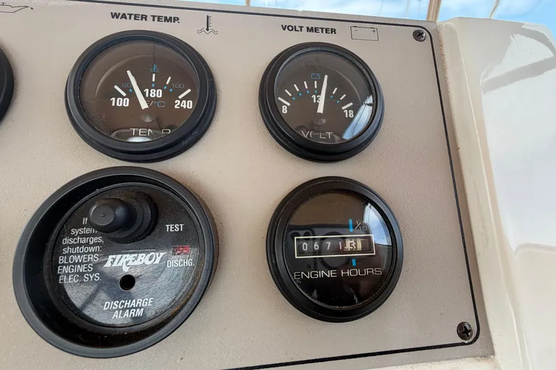 Slide: The Image of Instrument panel of a 1999 Carver 380 Santego showing gauges and engine hours. - 21