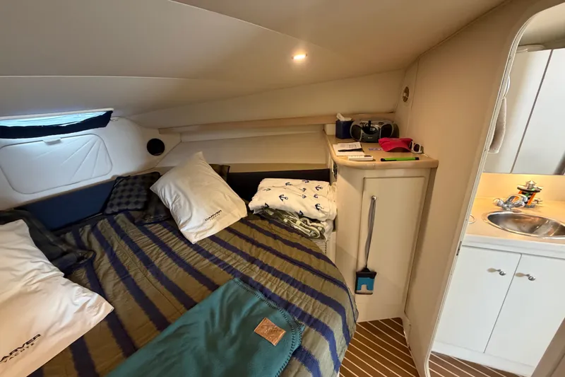 Slide: The Image of Interior of 1999 Carver 380 Santego yacht with cozy bed and compact kitchenette. - 46