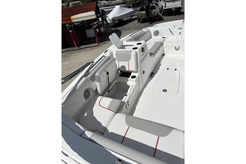 Slide: The Image of Interior of a 2022 Tahoe 1950 boat, featuring white seating with red accents. - 7