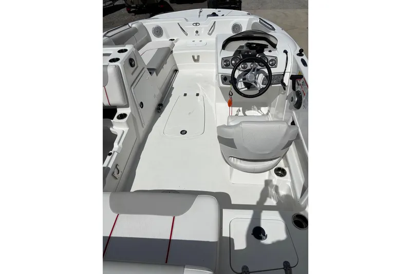 Slide: The Image of Interior view of a 2022 Tahoe 1950 boat, featuring a sleek white design and modern controls. - 6