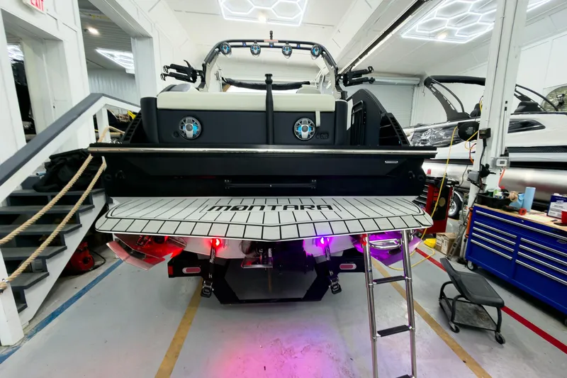 Slide: The Image of 2025 Montara Surf Boss 2.0 - SL 25' boat in a workshop setting. - 23