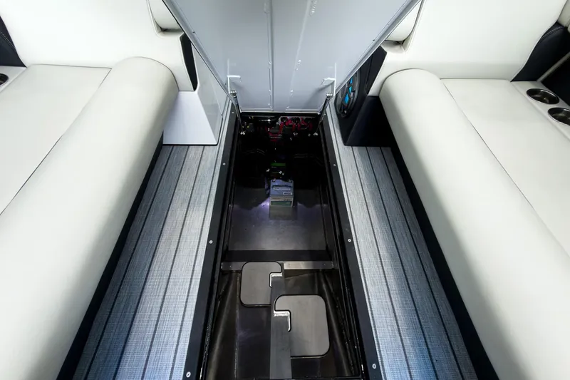 Slide: The Image of Interior view of 2025 Montara Surf Boss 2.0 SL 25' boat, showcasing seating and storage. - 8