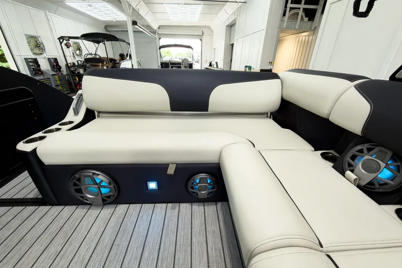 Slide: The Image of Luxurious interior of 2025 Montara Surf Boss 2.0 SL 25' with plush seating and speakers. - 14