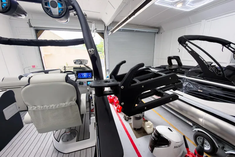 Slide: The Image of Interior view of 2025 Montara Surf Boss 2.0 - SL 25' boat in a garage. - 21