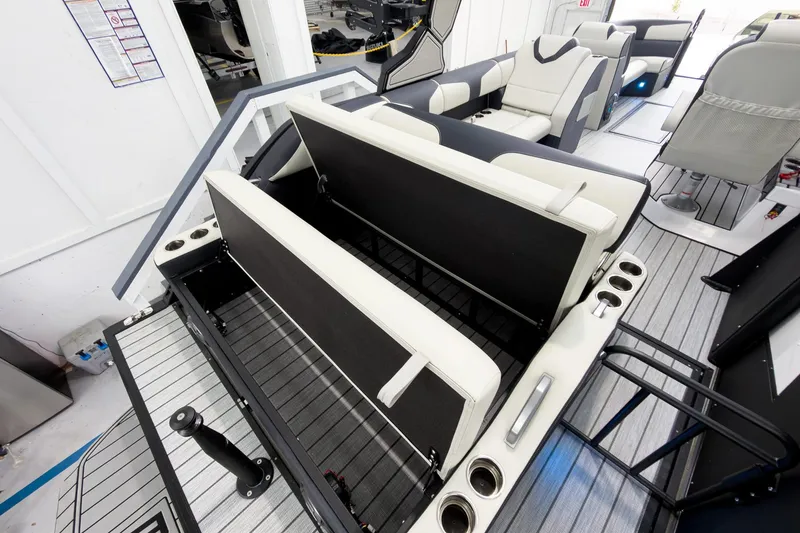 Slide: The Image of 2025 Montara Surf Boss 2.0 SL 25' boat interior with adjustable seating and cup holders. - 19
