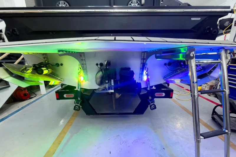 Slide: The Image of Rear view of 2025 Montara Surf Boss 2.0 - SL 25' with illuminated underwater lights. - 22