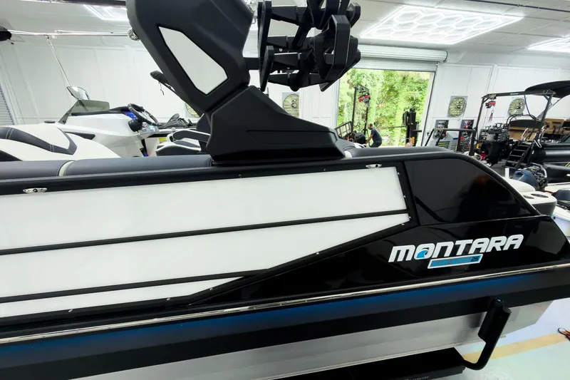 Slide: The Image of 2025 Montara Surf Boss 2.0 - SL 25' boat in showroom, sleek design, modern features. - 4