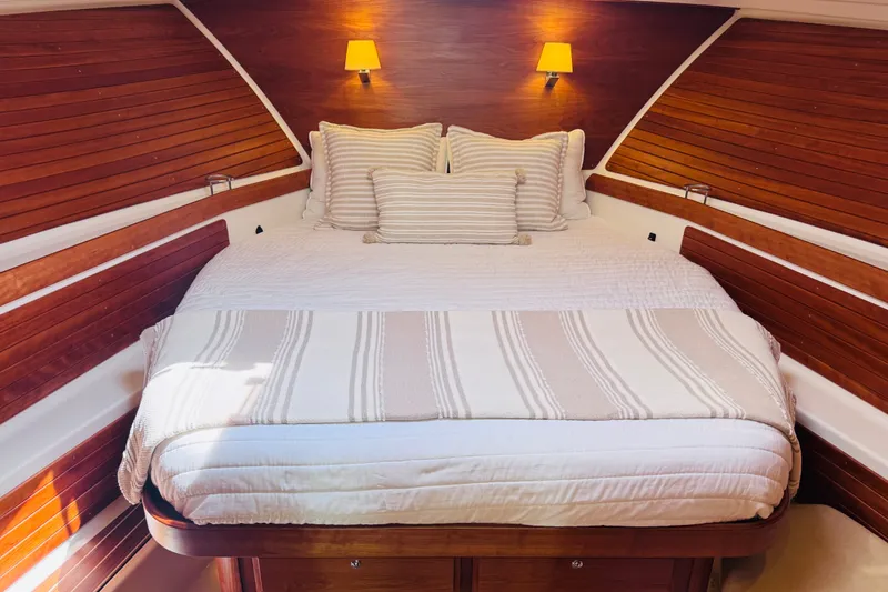 Slide: The Image of Luxurious cabin interior of 2018 Back Cove 37 yacht with cozy bed and warm lighting. - 4