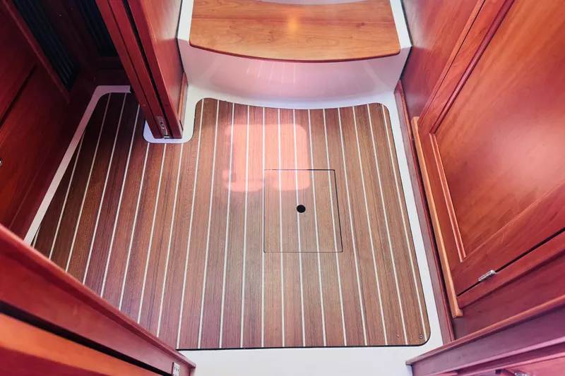Slide: The Image of 2018 Back Cove 37 interior with wood flooring and cabinetry. - 13