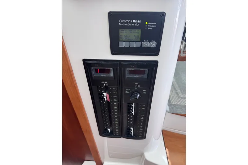 Slide: The Image of Control panel of a 2018 Back Cove 37 boat with Cummins Onan marine generator. - 46