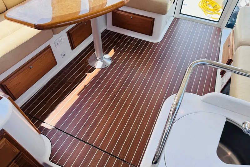 Slide: The Image of Luxurious interior of 2018 Back Cove 37 yacht with wood flooring and seating. - 28
