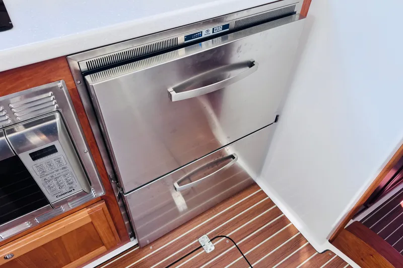Slide: The Image of Stainless steel refrigerator and microwave in 2018 Back Cove 37 yacht kitchen. - 21