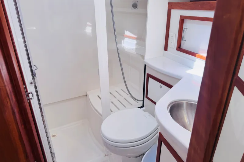 Slide: The Image of Luxurious bathroom in 2018 Back Cove 37 yacht with shower, toilet, and sink. - 19