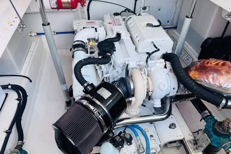 Slide: The Image of Engine room of a 2018 Back Cove 37 boat, showcasing a clean, organized layout. - 37