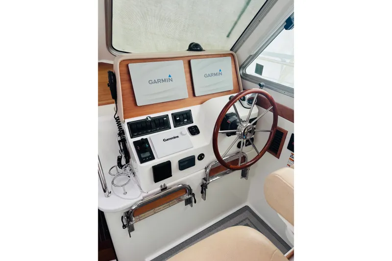 Slide: The Image of 2018 Back Cove 37 helm with Garmin displays and Cummins controls. - 2