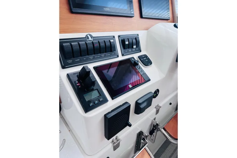 Slide: The Image of Control panel of a 2018 Back Cove 37 boat with navigation equipment. - 31