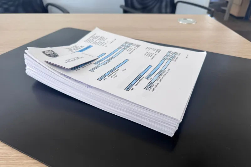 Slide: The Image of Stack of documents on a desk, related to a 2018 Back Cove 37 model. - 7