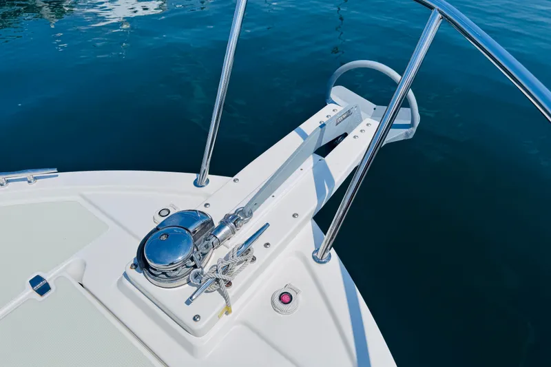Slide: The Image of Bow of 2018 Back Cove 37 boat with anchor and railing on calm water. - 55