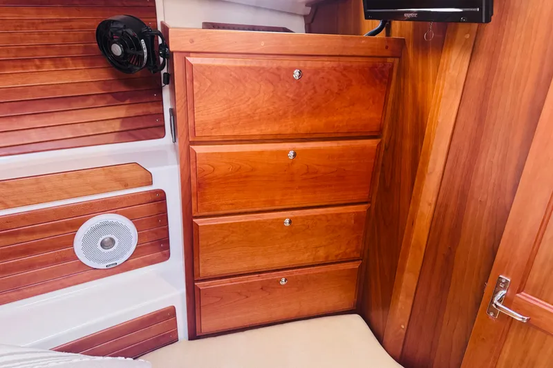 Slide: The Image of Interior of 2018 Back Cove 37 yacht with wooden cabinetry and built-in speaker. - 8
