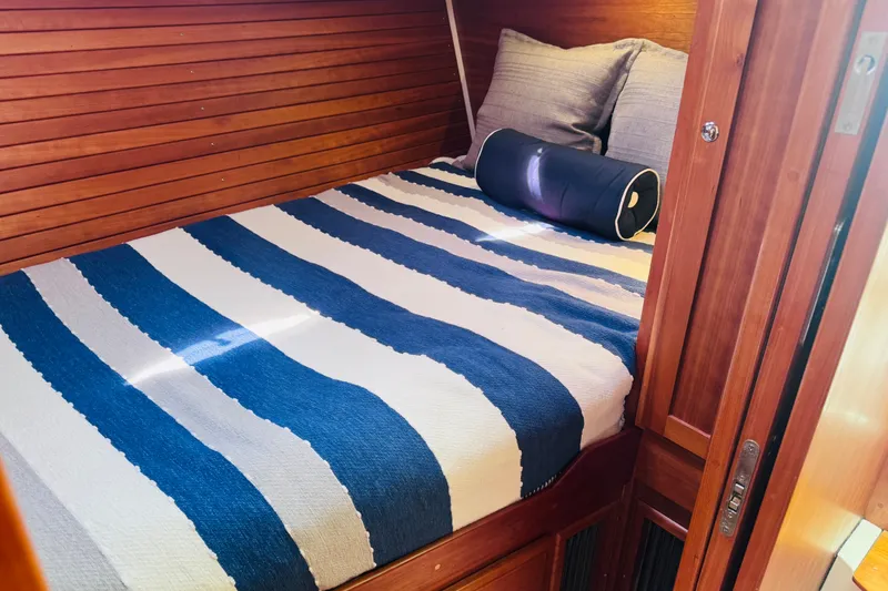 Slide: The Image of Cozy cabin bed with striped bedding in 2018 Back Cove 37 yacht. - 15