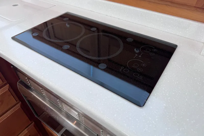 Slide: The Image of Modern glass cooktop on 2018 Back Cove 37 yacht's sleek kitchen counter. - 24