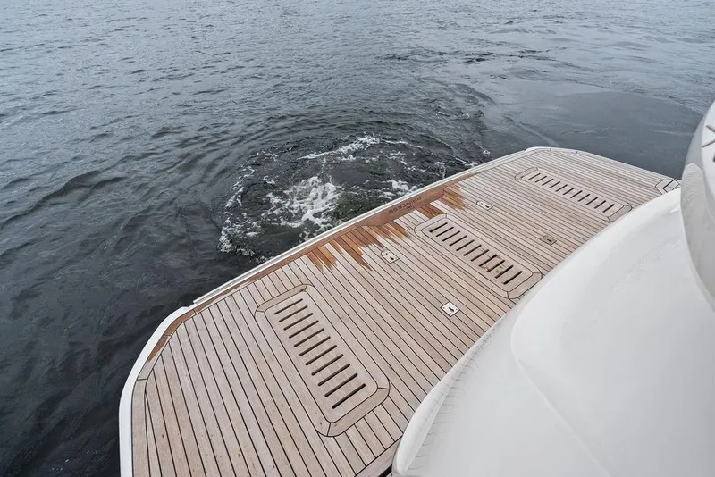 Slide: The Image of Teak deck of 2020 Princess S62 yacht on calm water. - 25