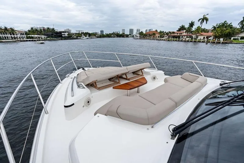 Slide: The Image of Luxurious 2020 Princess S62 yacht with spacious deck and scenic waterfront view. - 12