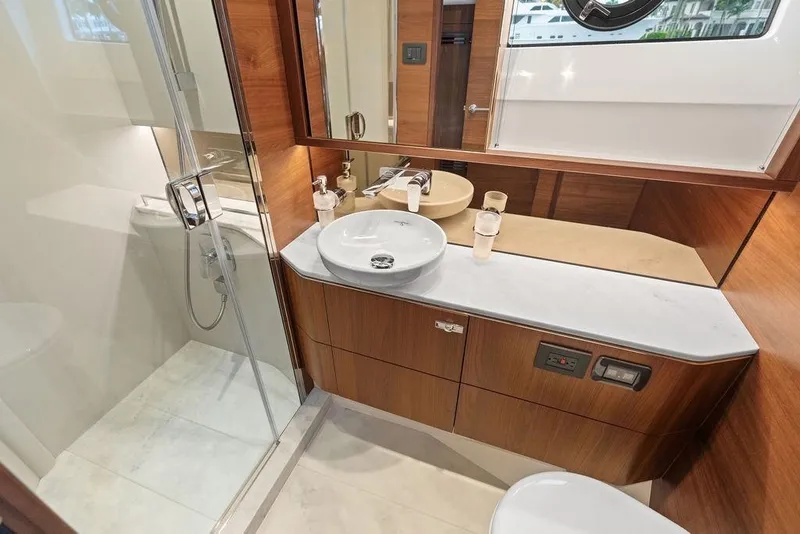 Slide: The Image of Luxurious bathroom in 2020 Princess S62 yacht with modern fixtures and wooden cabinetry. - 60