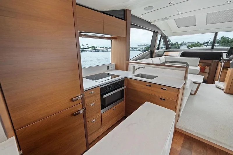 Slide: The Image of Luxurious 2020 Princess S62 yacht interior with modern kitchen and elegant wood finishes. - 38