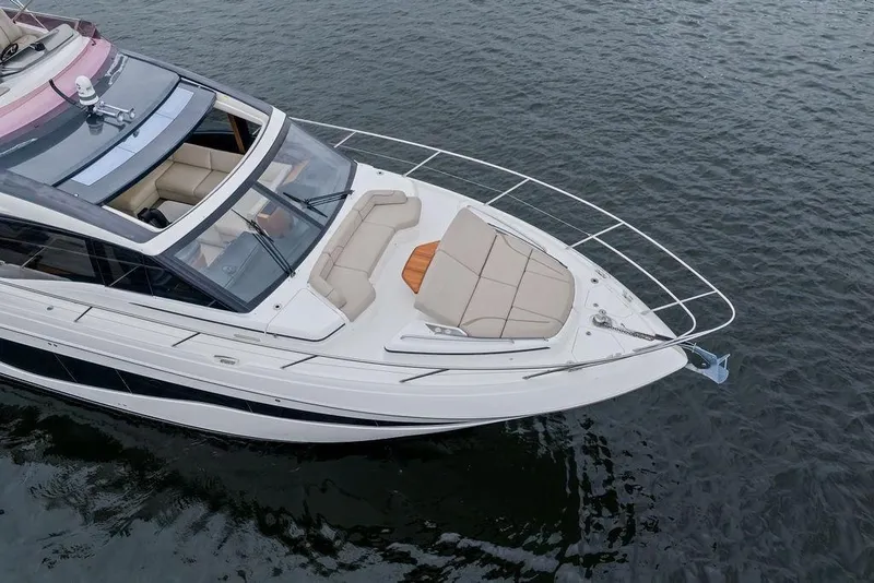 Slide: The Image of Luxury 2020 Princess S62 yacht with spacious deck, cruising on calm waters. - 6