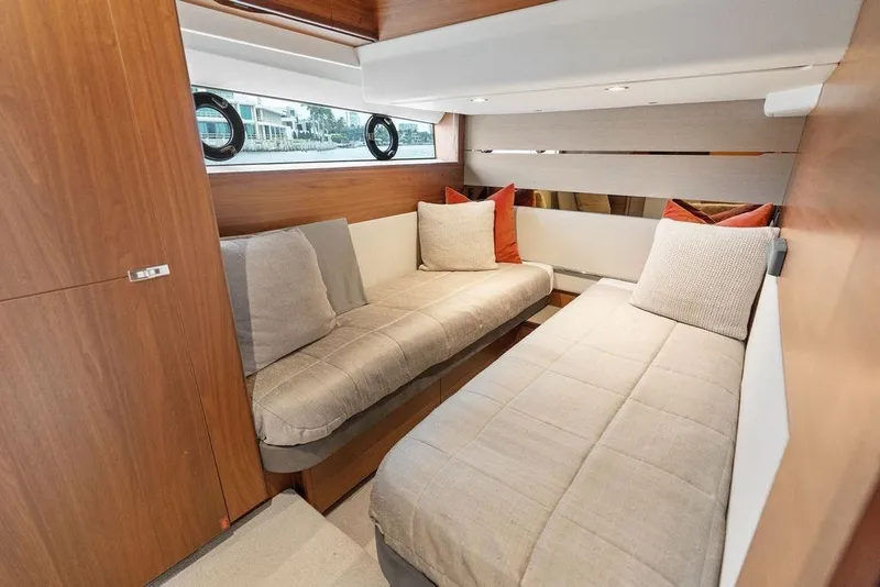 Slide: The Image of Luxurious 2020 Princess S62 yacht cabin with twin beds and elegant wood finish. - 51