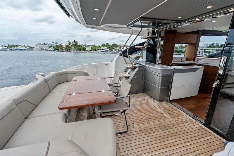 Slide: The Image of Luxurious 2020 Princess S62 yacht deck with seating, table, and modern interior view. - 31