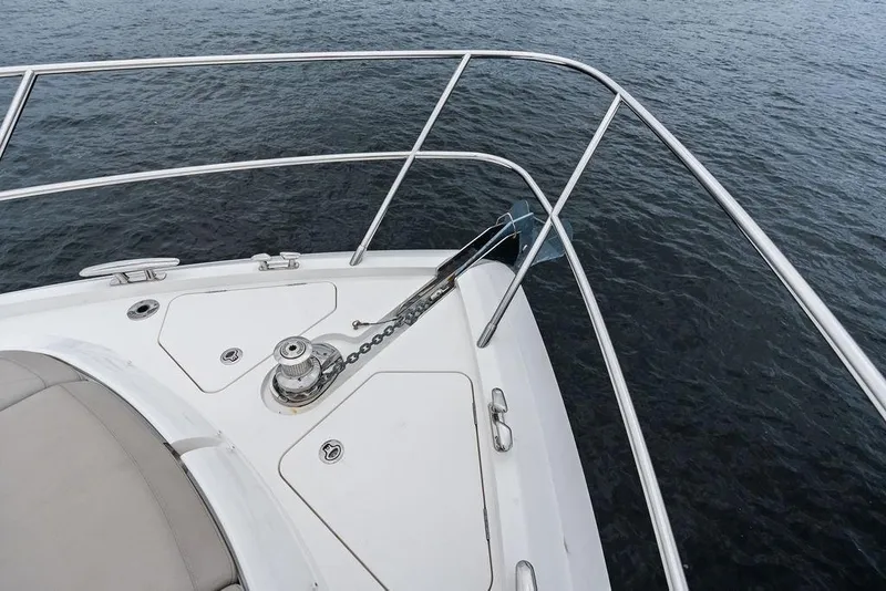 Slide: The Image of Bow of 2020 Princess S62 yacht with anchor and railing over water. - 15