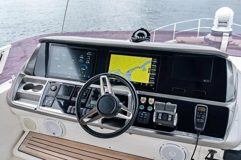 Slide: The Image of Cockpit of 2020 Princess S62 yacht with navigation screens and controls. - 24