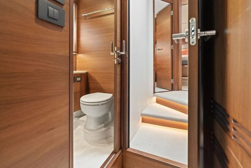 Slide: The Image of Luxurious 2020 Princess S62 yacht interior with wooden finish and modern bathroom. - 59