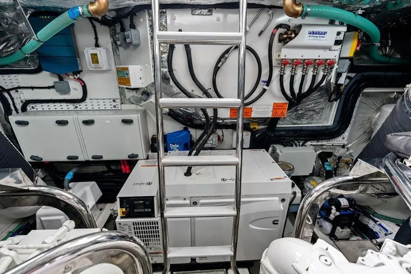 Slide: The Image of Engine room of a 2020 Princess S62 yacht, featuring complex machinery and control systems. - 70