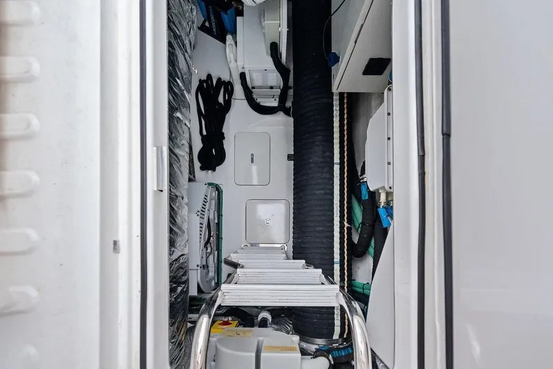 Slide: The Image of Engine room of a 2020 Princess S62 yacht, showcasing mechanical components and wiring. - 69