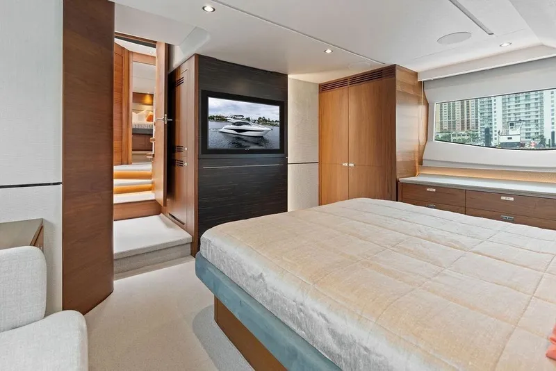 Slide: The Image of Luxurious 2020 Princess S62 yacht bedroom with modern decor and large window view. - 65