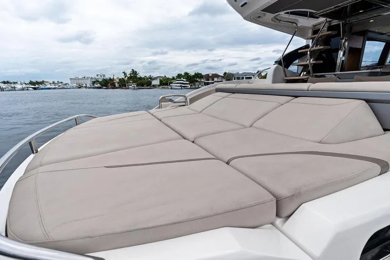 Slide: The Image of Luxurious 2020 Princess S62 yacht with spacious sunbathing deck, docked by serene waterfront. - 29