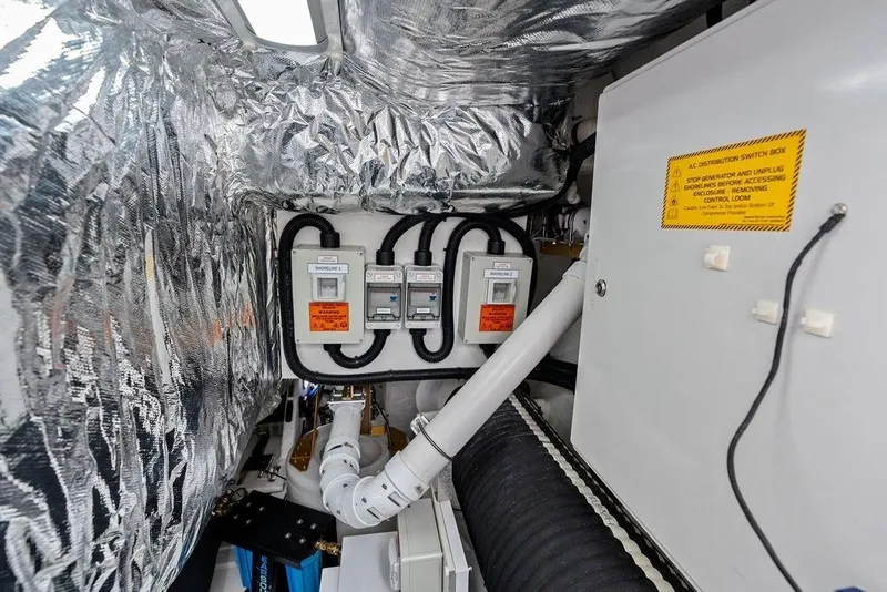 Slide: The Image of Engine room of 2020 Princess S62 yacht with electrical panels and insulation. - 79