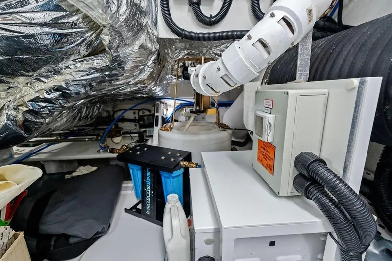 Slide: The Image of Engine room of a 2020 Princess S62 yacht, featuring mechanical and electrical components. - 78