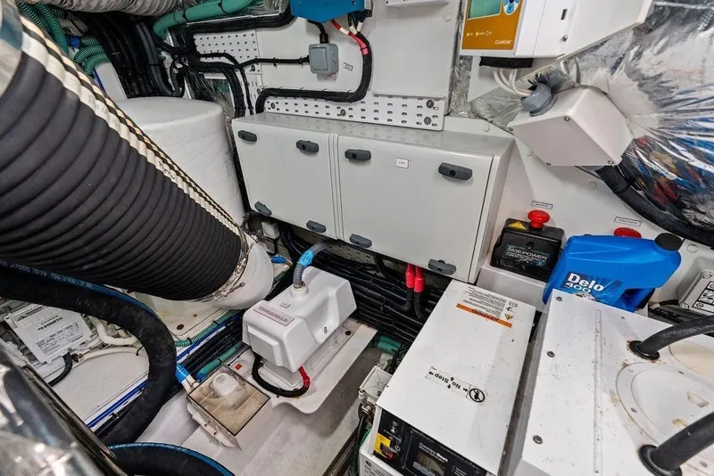 Slide: The Image of Engine room of a 2020 Princess S62 yacht, showcasing mechanical and electrical components. - 83
