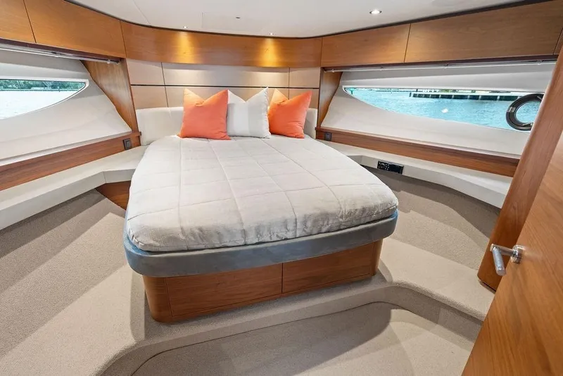 Slide: The Image of Luxurious cabin interior of 2020 Princess S62 yacht with elegant bedding and wood accents. - 53