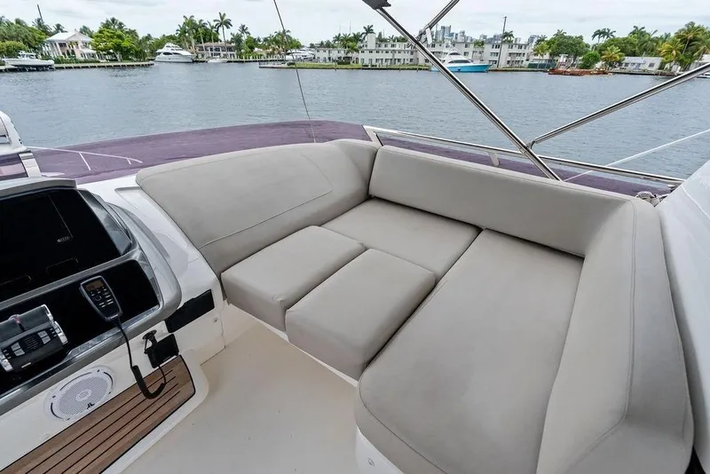 Slide: The Image of Luxurious seating area on a 2020 Princess S62 yacht, overlooking a serene waterfront. - 21