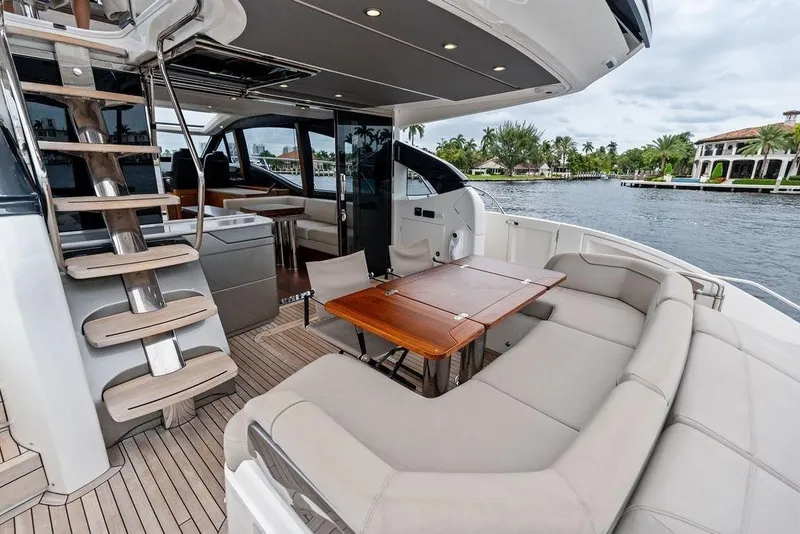 Slide: The Image of Luxurious 2020 Princess S62 yacht with elegant seating and dining area on deck. - 28