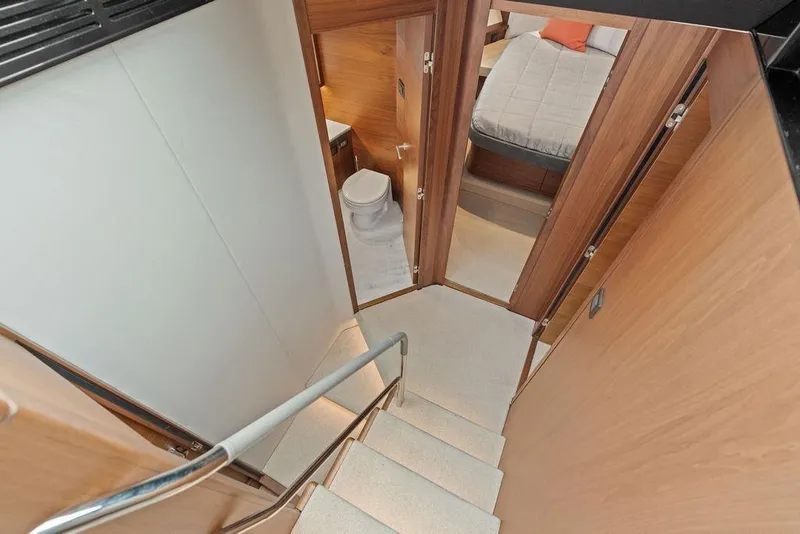 Slide: The Image of Interior view of 2020 Princess S62 yacht, featuring stairs, bathroom, and bedroom. - 48