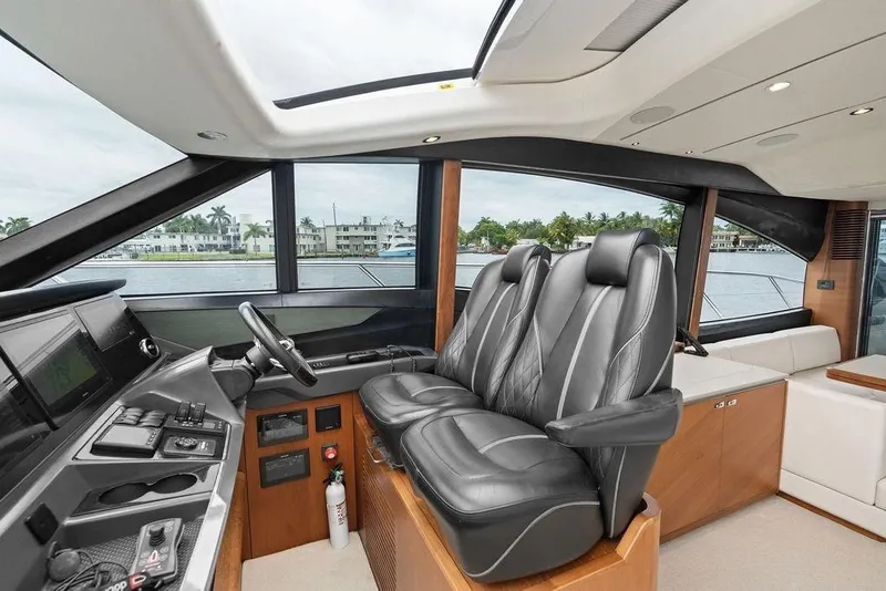 Slide: The Image of Luxurious interior of 2020 Princess S62 yacht with leather seating and modern helm controls. - 45