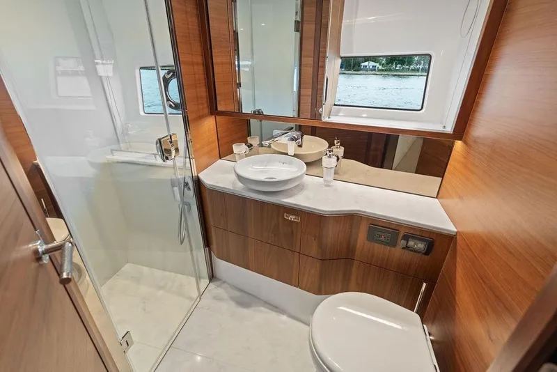 Slide: The Image of Luxurious bathroom interior of 2020 Princess S62 yacht with wood accents and modern fixtures. - 56