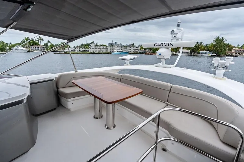 Slide: The Image of Luxurious 2020 Princess S62 yacht deck with seating, table, and Garmin navigation system. - 17